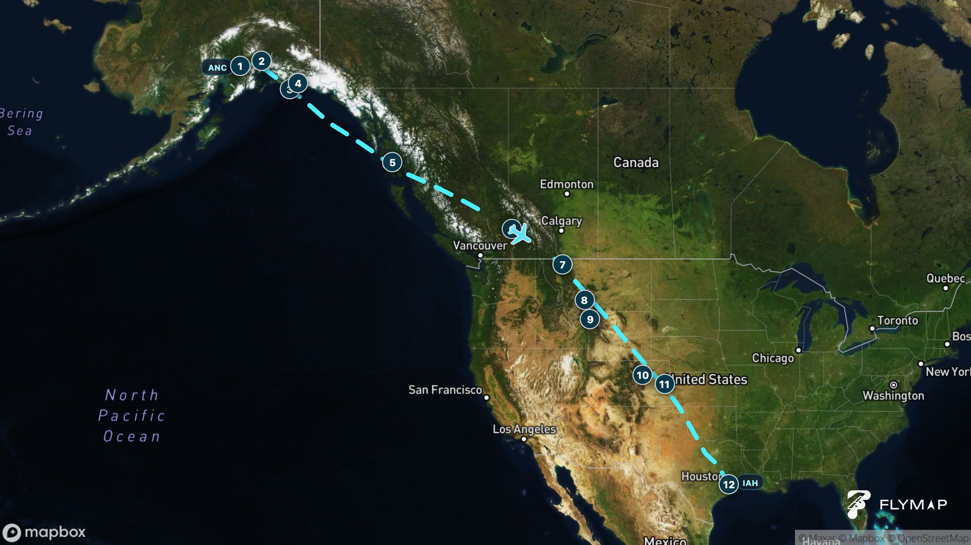 Map of the Anchorage to Houston flight route across Alaska, British Columbia, the Rocky Mountains, the Great Plains, and Texas.