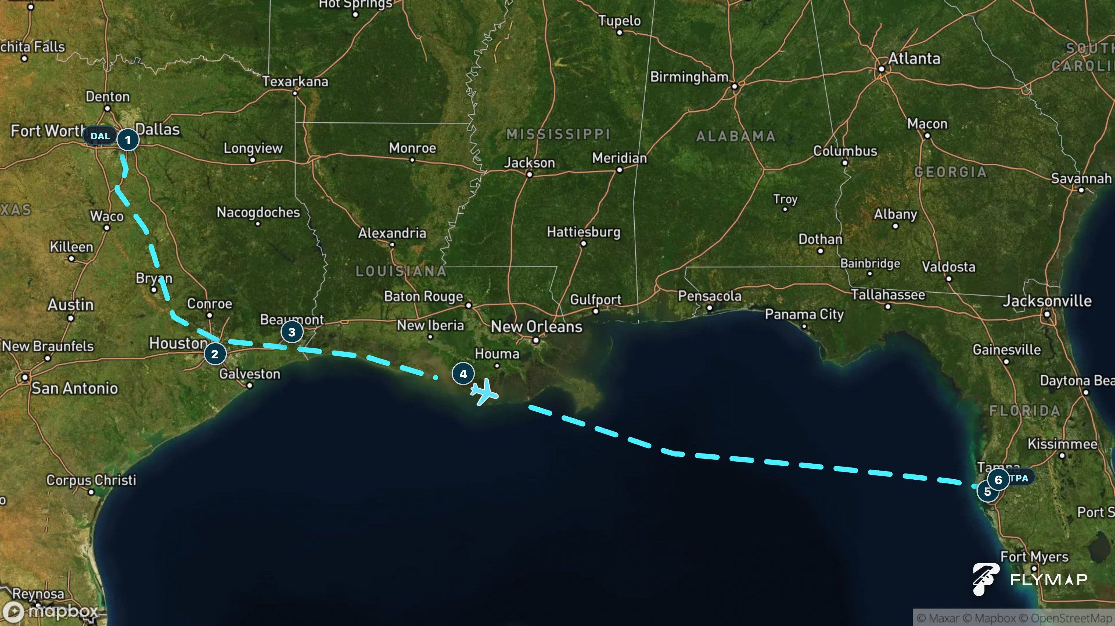 Flight path from Dallas across the Gulf of Mexico toward Tampa, showing the changing terrain below